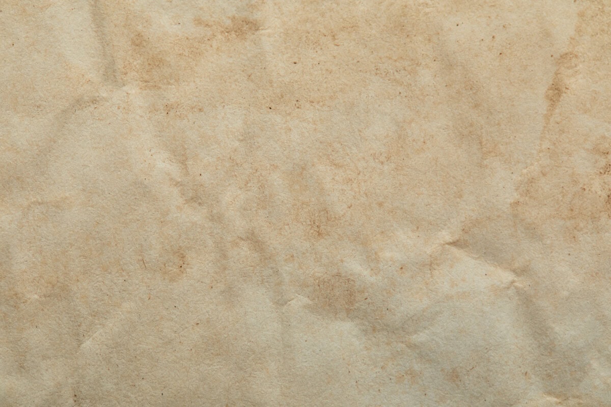 Top view of crumpled vintage beige paper texture with copy space